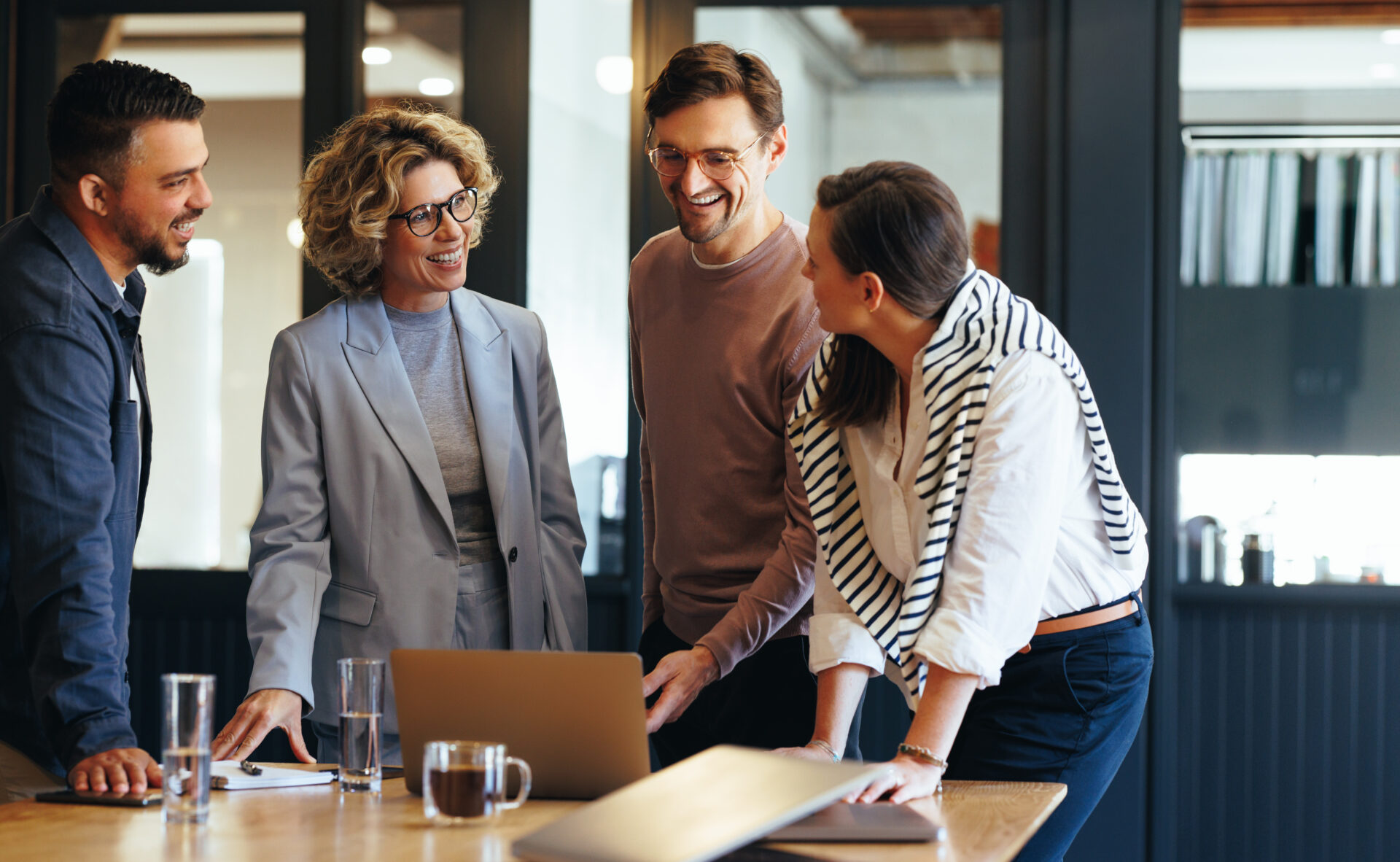 Group of coworkers discussing how to reconcile accounts